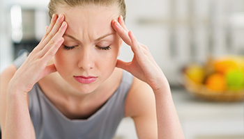 woman with Headaches and Neck Aches TMJ Treatment - North Royalton, OH