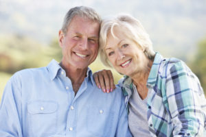 Older Couple Smiling Together After Their Cosmetic Dentistry Appointments