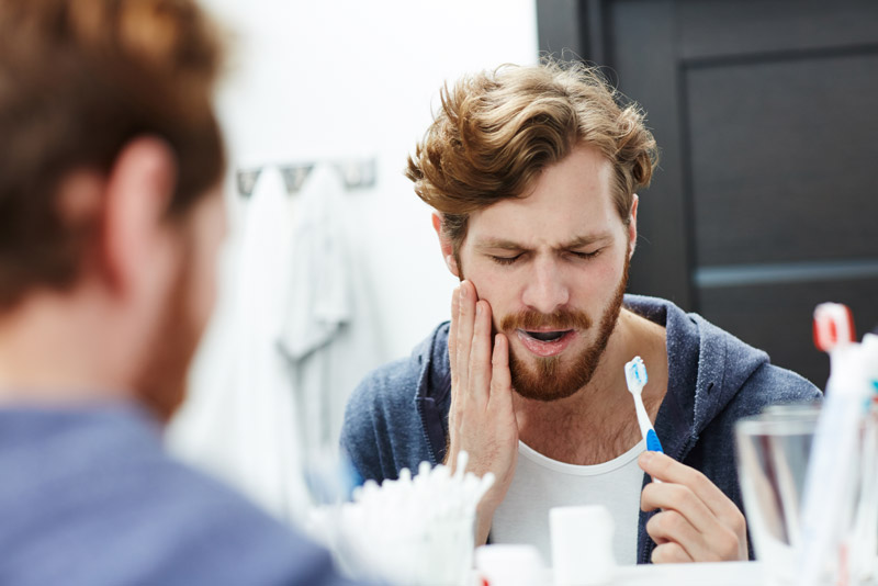 Dental Patient Suffering From Mouth Pain Due To Gum Disease