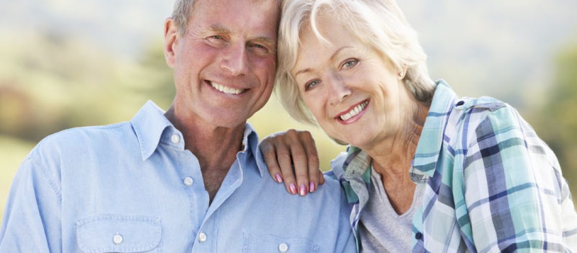 Older Couple Smiling Together After Their Cosmetic Dentistry Appointments